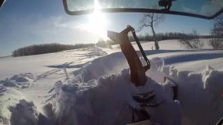 Hardcore snow blowing 6 foot deep snow drifts with the massey ferguson 4609 [upl. by Ahseena]