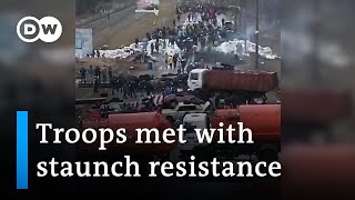 Footage shows how citizens try to stall Russian forces all over Ukraine  DW News [upl. by Wahl134]