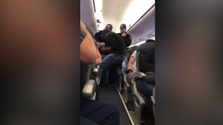 Video shows a passenger forcibly dragged off a United Airlines plane [upl. by Dexter]