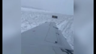 Dramatic video shows plane slide off runway at Chicagos OHare Airport due to icy conditions [upl. by Ayanej]